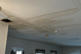 Screenshot-2026-04-30-142423.png Ceiling showing extensive water damage and sagging drywall caused by a roof or plumbing leak.